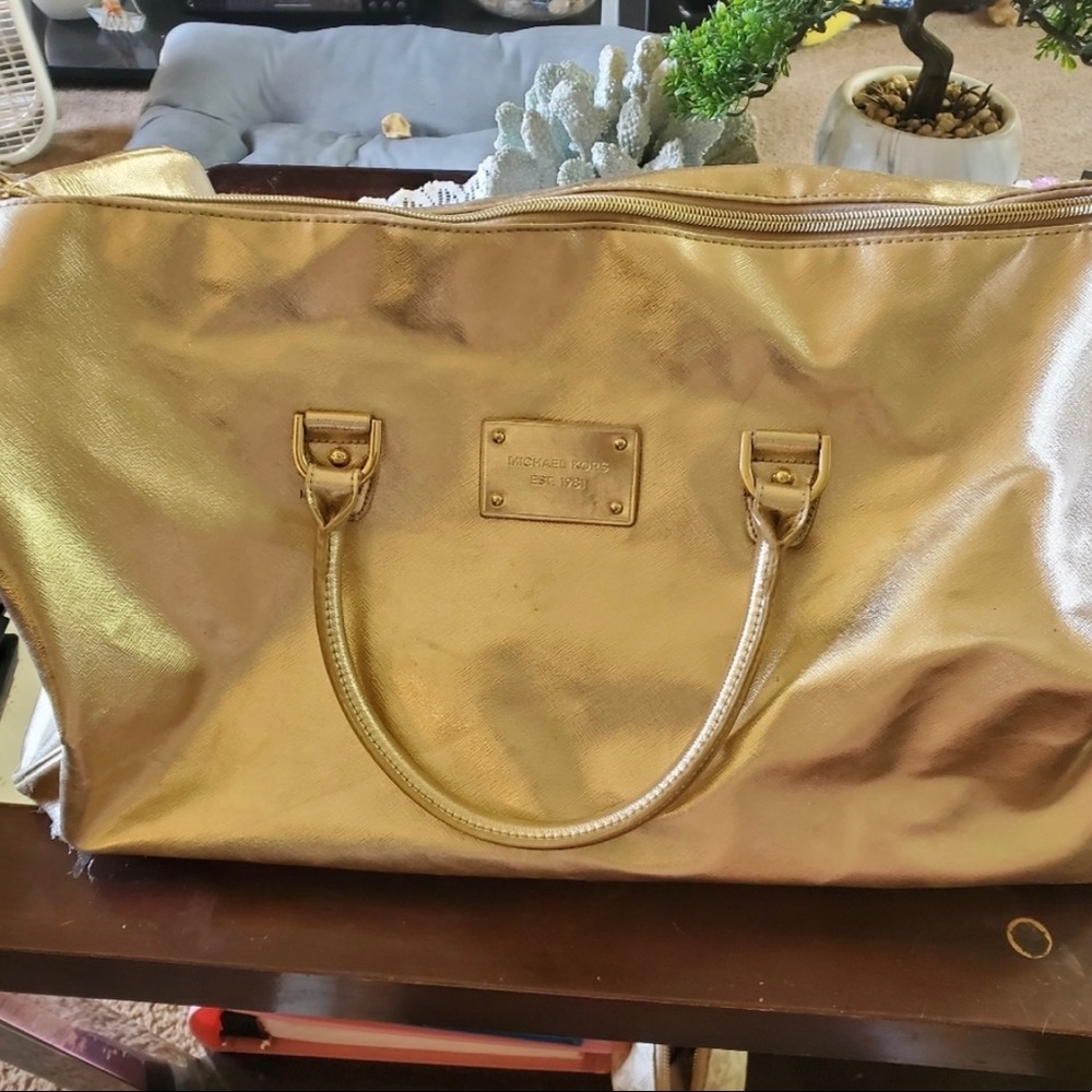 Michael kors gold duffle bag